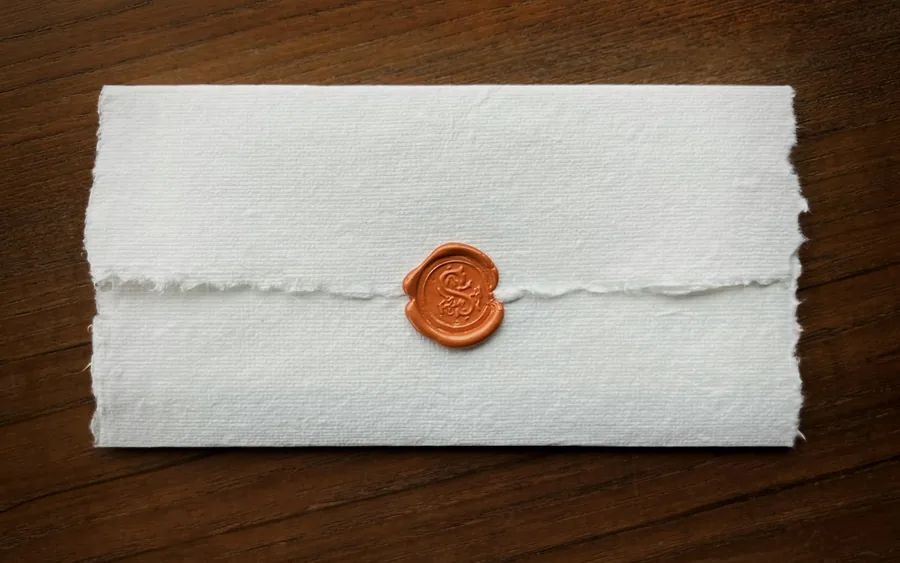 A sealed envelope closed with a wax seal, ready for same-day legal document courier